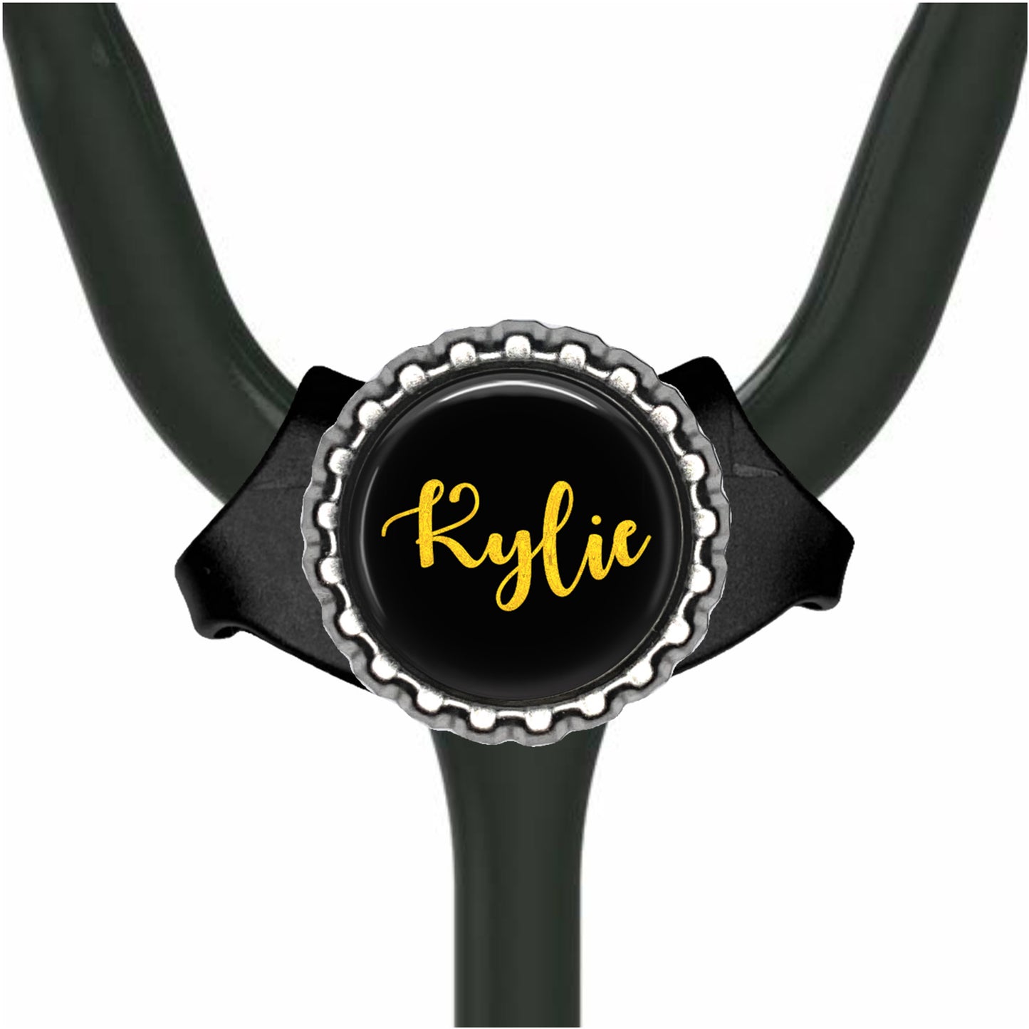 A black stethoscope with a personalized name badge attached to it.