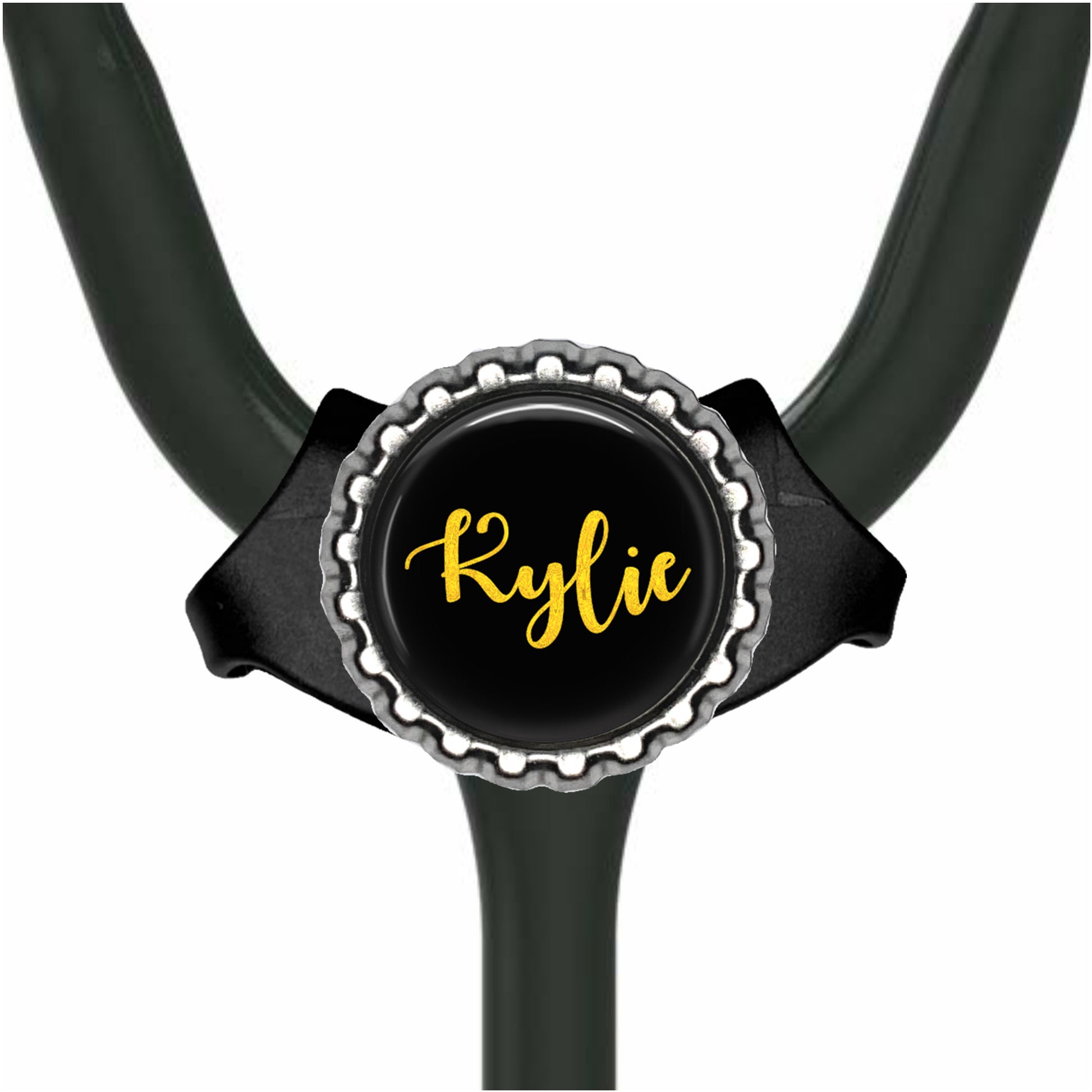 A black stethoscope with a personalized name badge attached to it.