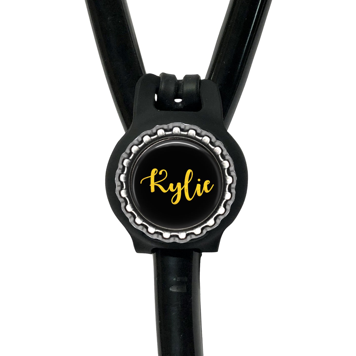A black stethoscope with a personalized name badge attached to it.