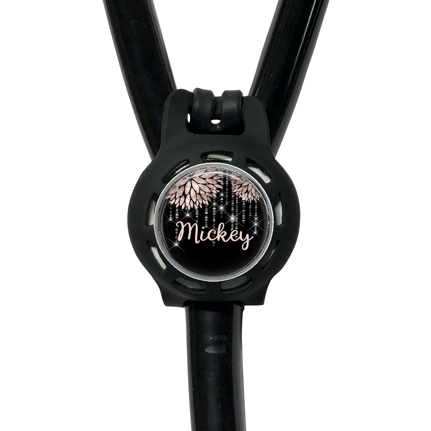 A black stethoscope with a round, personalized name tag attached to it.