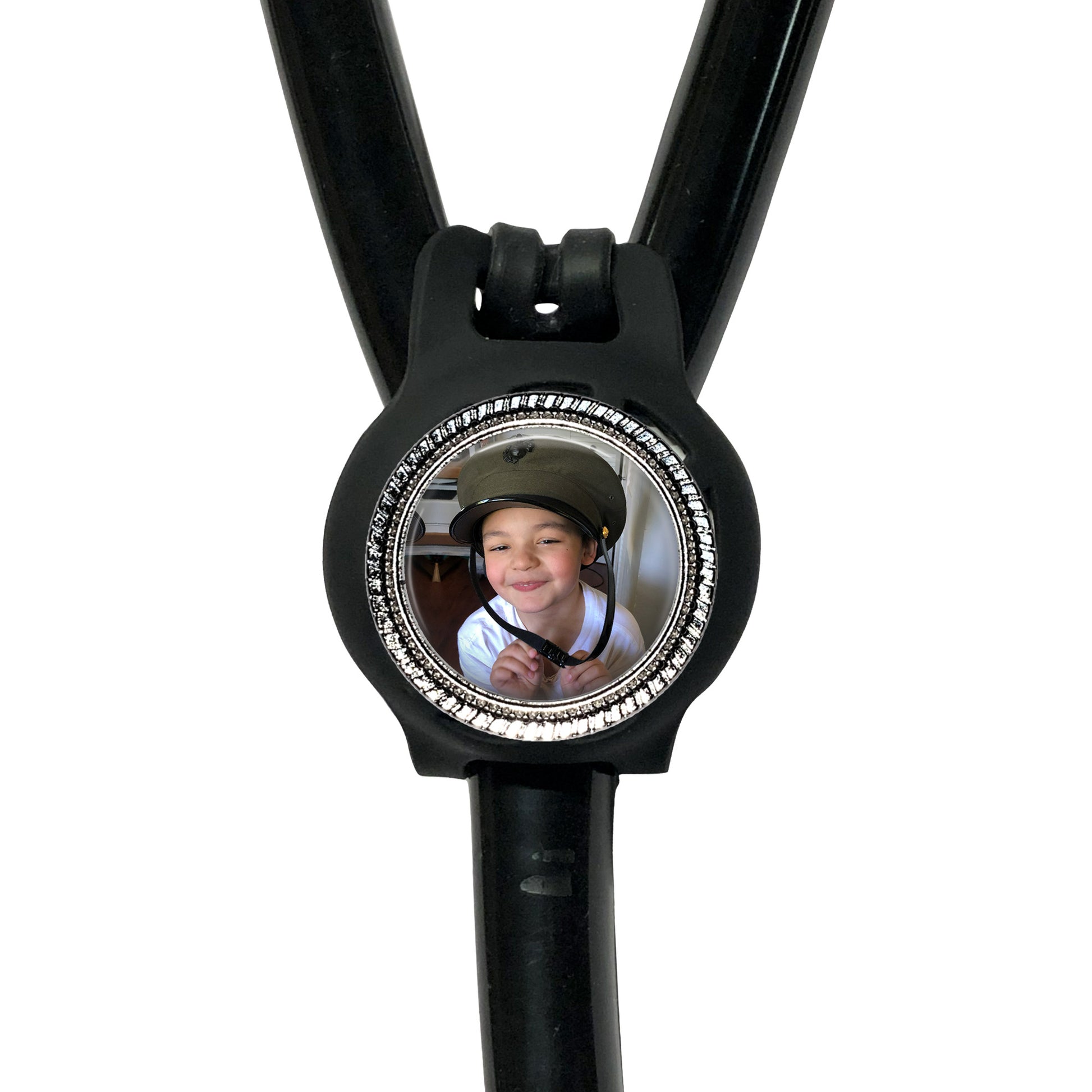 A black stethoscope with a circular frame containing a photo of a smiling person.