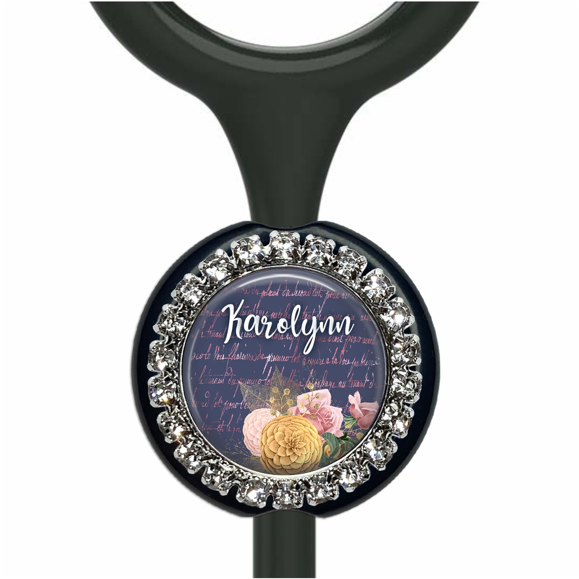 A black stethoscope with a decorative charm featuring a floral design and the name "Karen" written on it.