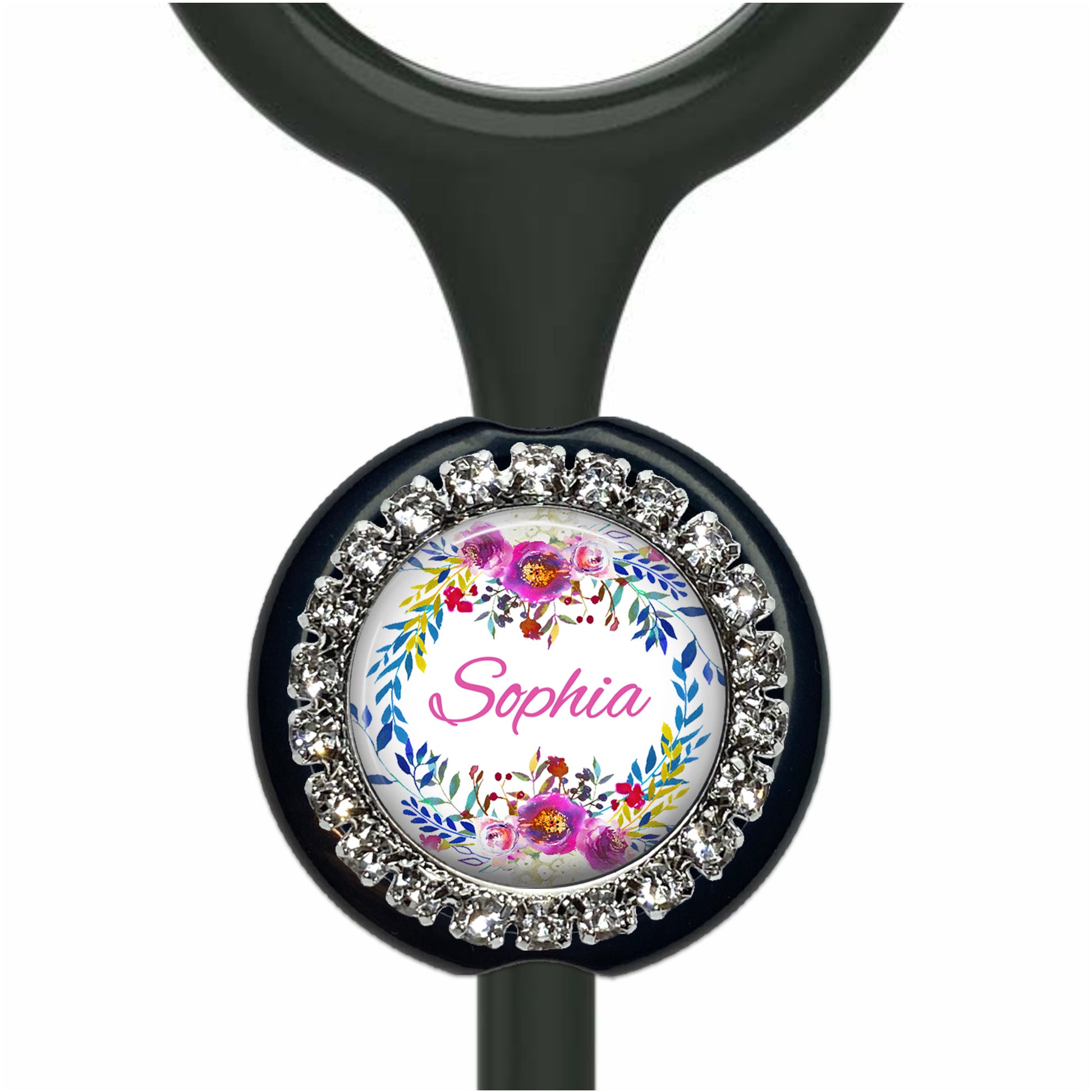 A personalized nameplate with a floral design and rhinestones around the edge.