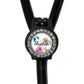 A black stethoscope with a personalized name badge attached to it.