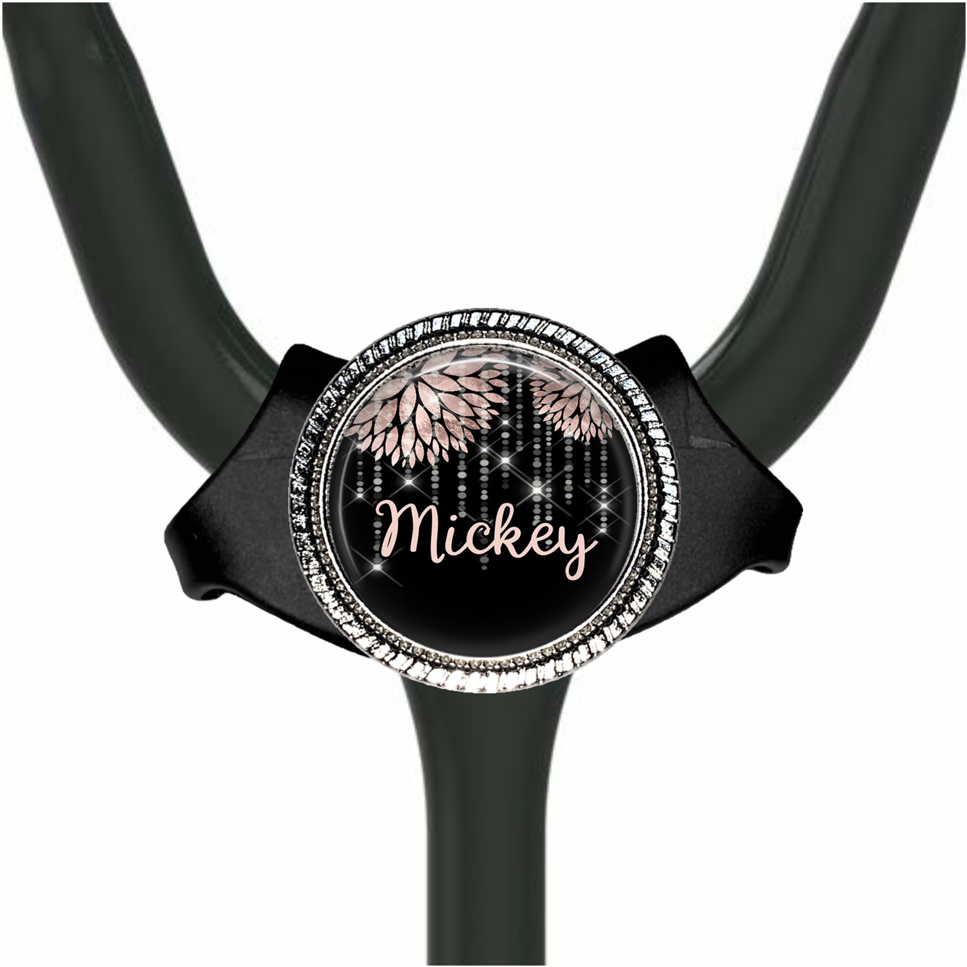 A black stethoscope with a personalized name badge on it.