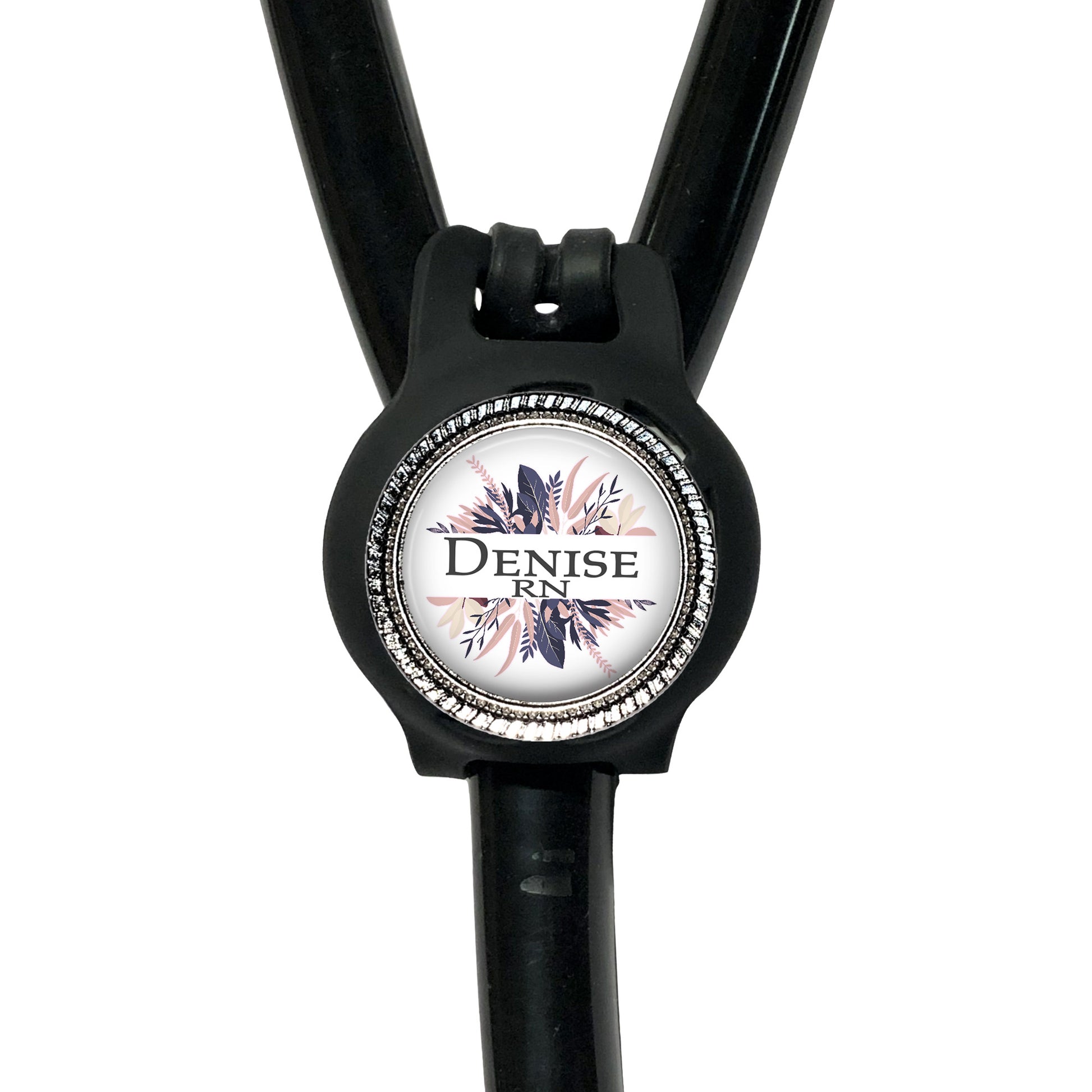 A black stethoscope with a round badge on the tubing, displaying the text "Denise RN".