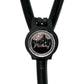 A black stethoscope with a round, personalized name tag attached to it.