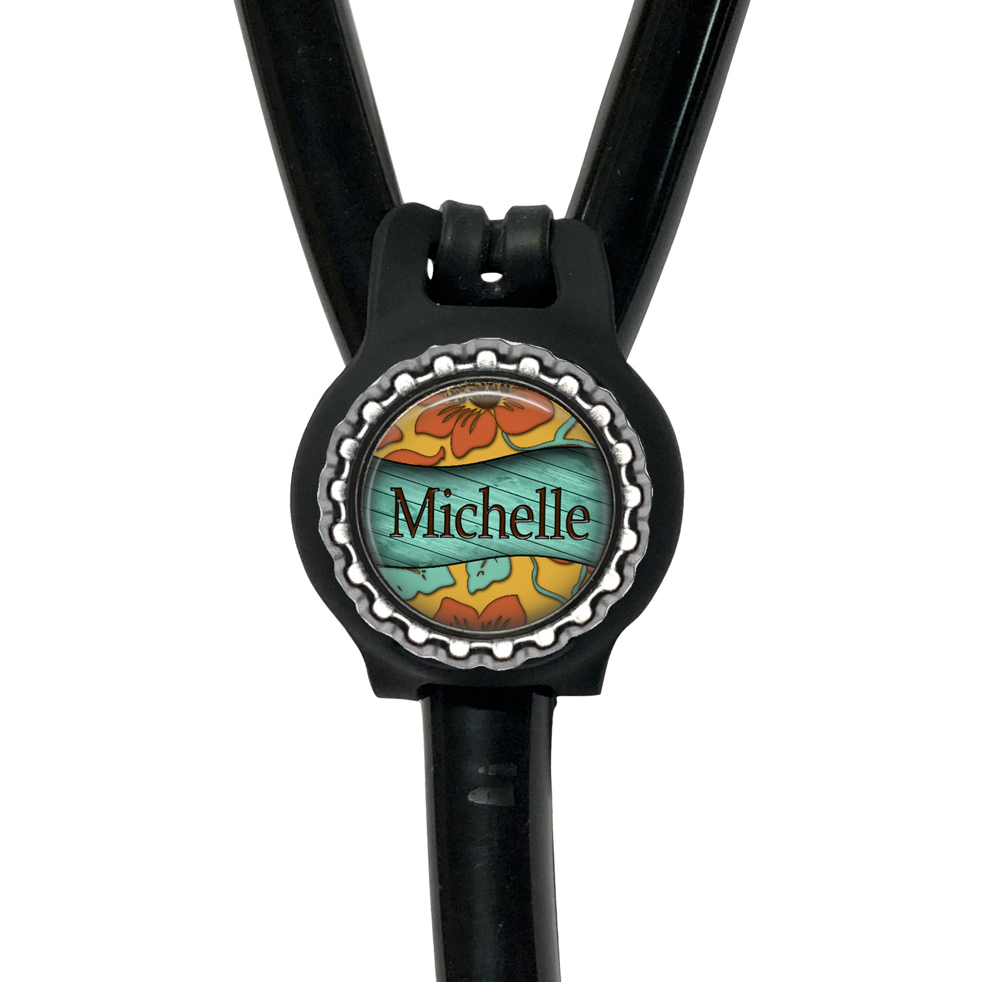 A black stethoscope with a personalized name tag attached to it.