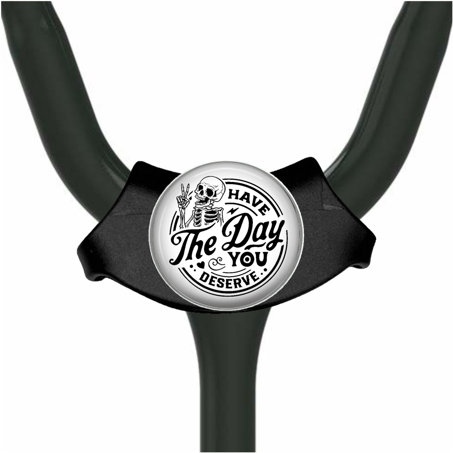 A black and white medical device with a circular badge featuring a skull and the text "HAVE THE DAY YOU DESERVE".