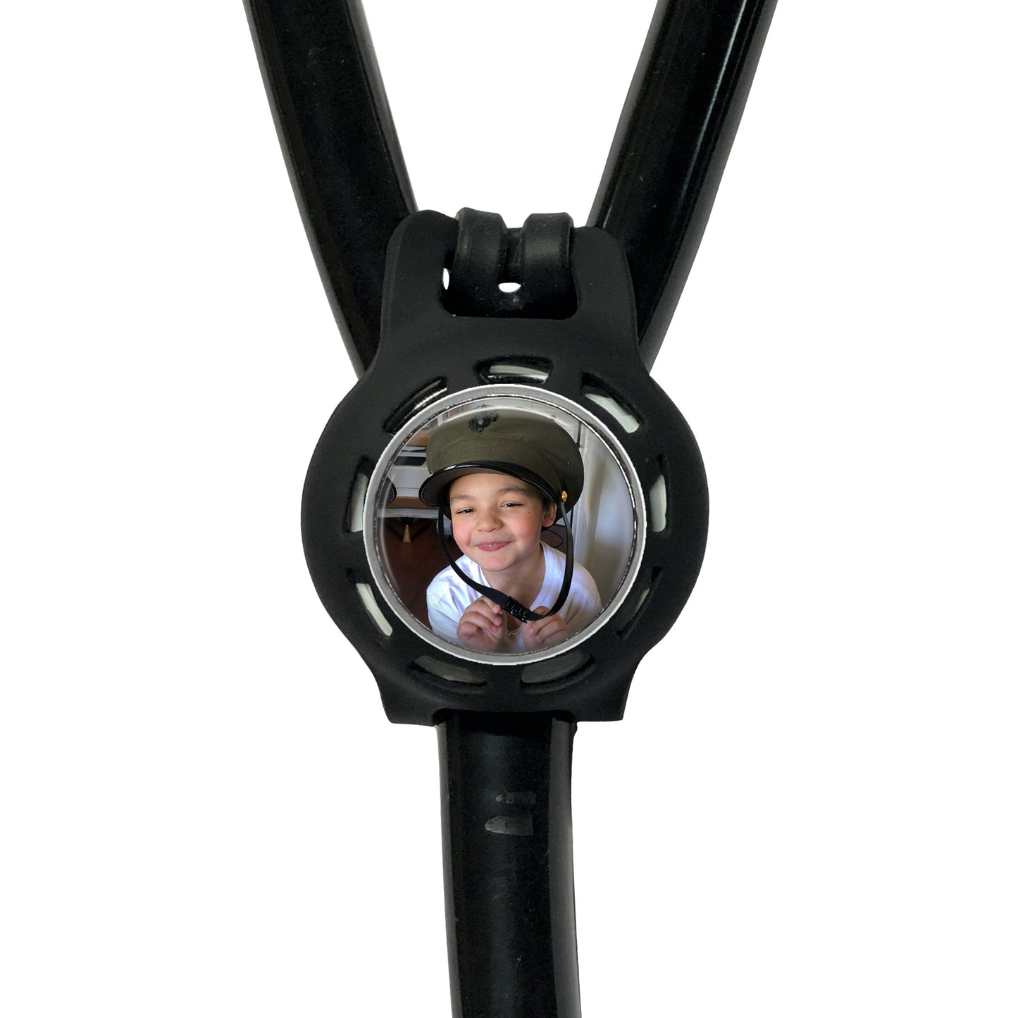 A black stethoscope with a circular mirror attached to it, displaying a smiling young boy wearing a helmet.