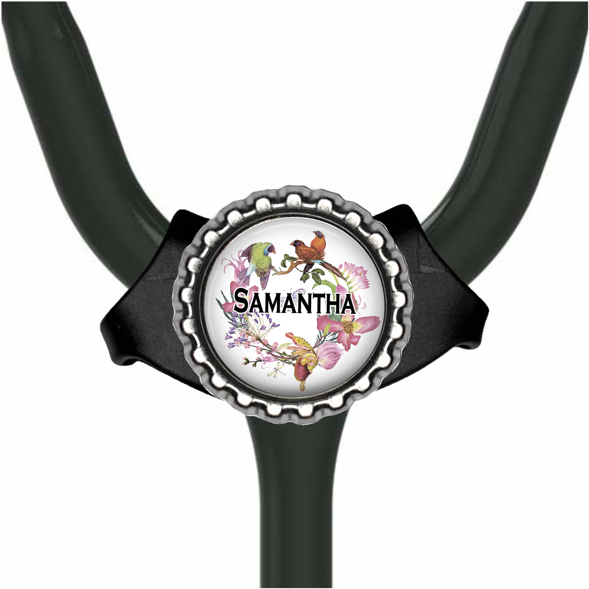A stethoscope with a personalized nameplate featuring a floral design and a bird.