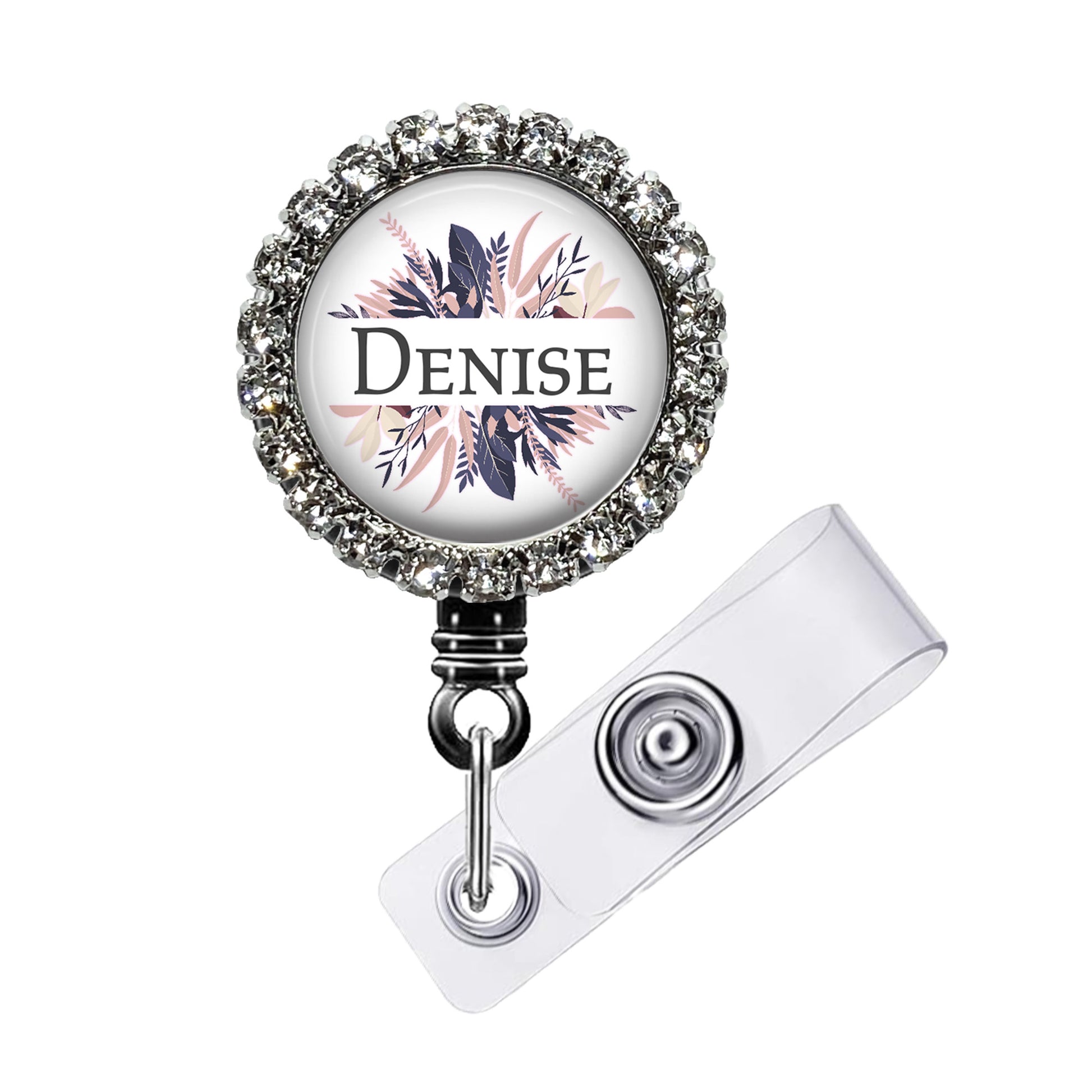 A personalized name badge with a floral design and the name Denise on it.