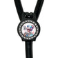 A black stethoscope with a round badge featuring a skull wearing a blue nurse's hat and the text "Coffee nurse prep" printed on it.