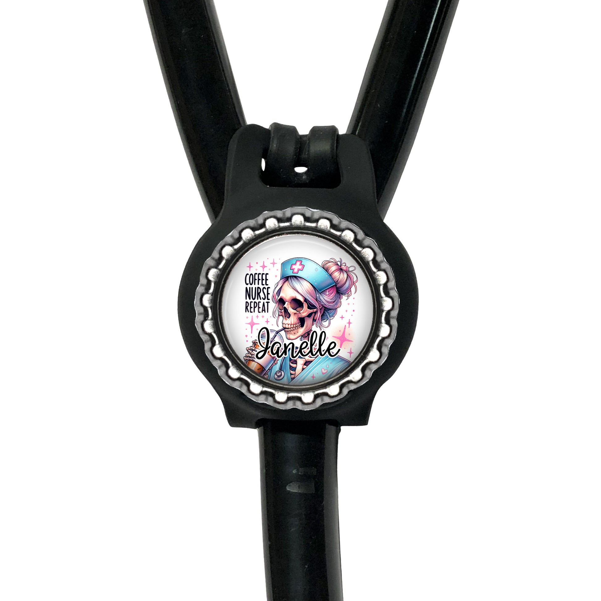 A black stethoscope with a round badge featuring a skull wearing a blue nurse's hat and the text "Coffee nurse prep" printed on it.
