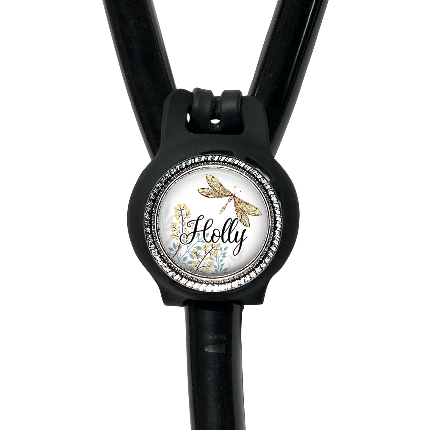 A black stethoscope with a round, decorative badge featuring a dragonfly and the name "Holly" written on it.