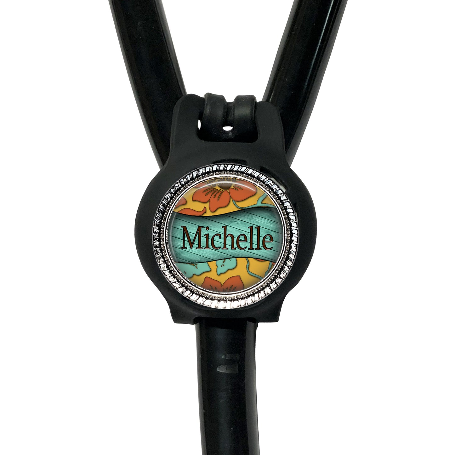 A black stethoscope with a personalized name badge attached to it.