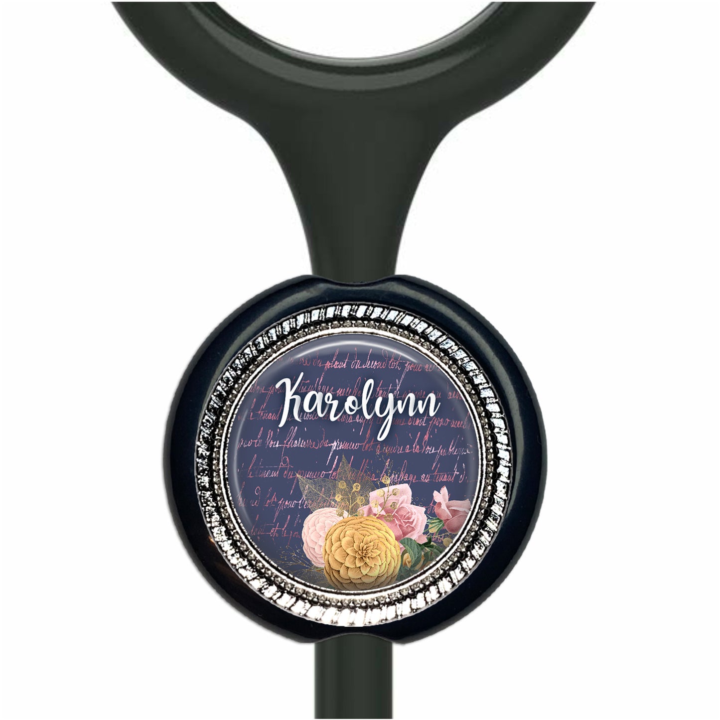 A black stethoscope with a round, decorative charm featuring a floral design and the name "Karen" written on it.
