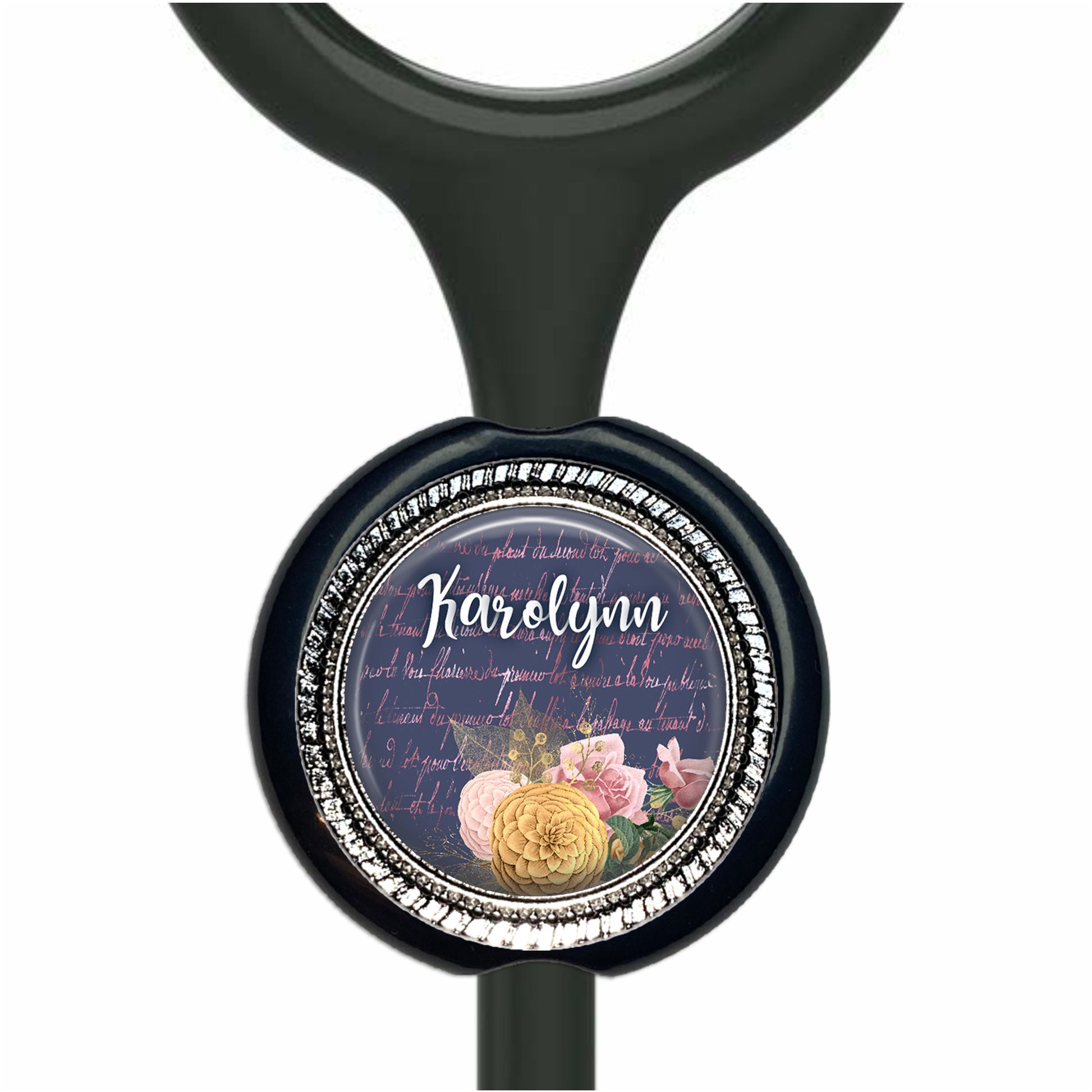 A black stethoscope with a round, decorative charm featuring a floral design and the name "Karen" written on it.