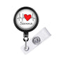 A black and white badge holder with a red heart and the word "Sienna" printed on it.