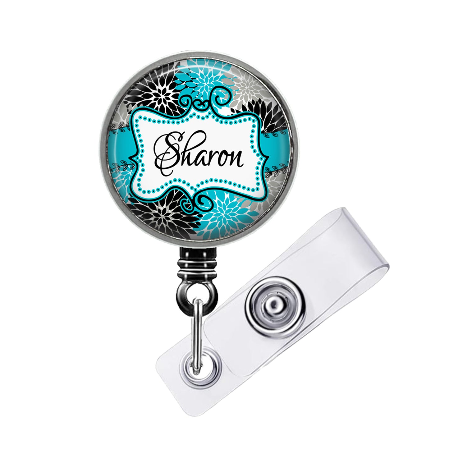 A round badge holder with a name tag attached to it. The name tag has the name "Sharon" written on it.