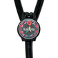 A black stethoscope with a personalized name badge attached to it.