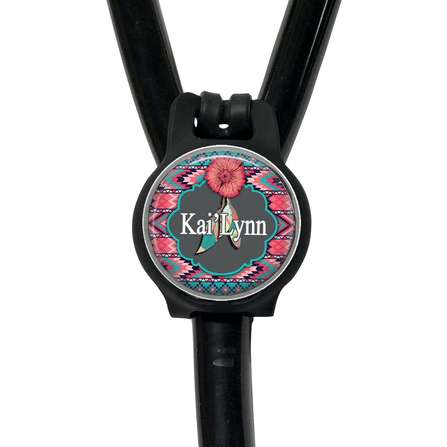 A black stethoscope with a personalized name badge attached to it.