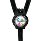 A black stethoscope with a personalized name badge attached to it.