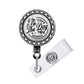A metal badge holder with a circular design featuring a skeleton and the text "The Day & You Deserve".