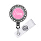 A personalized badge or lanyard with the name "Stacey" printed on it in a pink color.