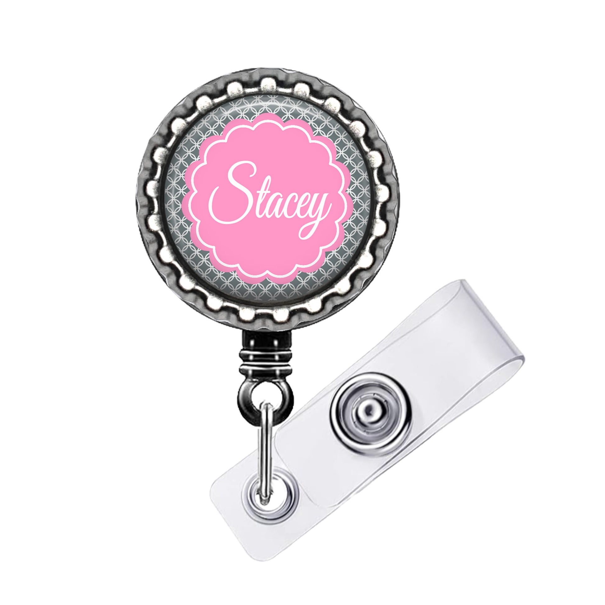A personalized badge or lanyard with the name "Stacey" printed on it in a pink color.