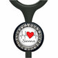 A black and silver medical device with a heart-shaped charm featuring a red heart and a line graph, along with the name "Siena" written on it.