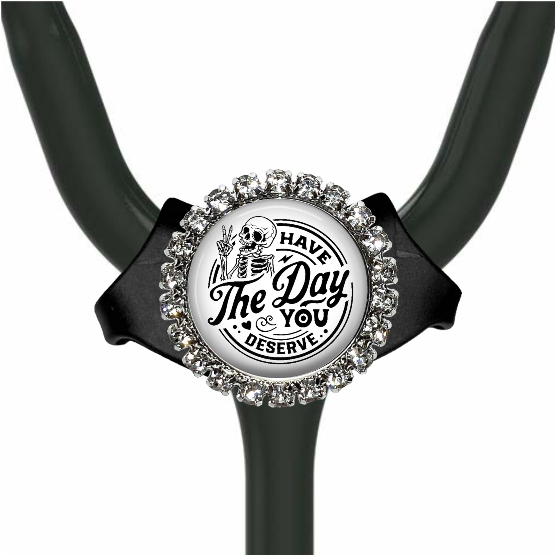 A black and white medical stethoscope with a decorative charm featuring a skeleton and the text "The Day You Deserve".