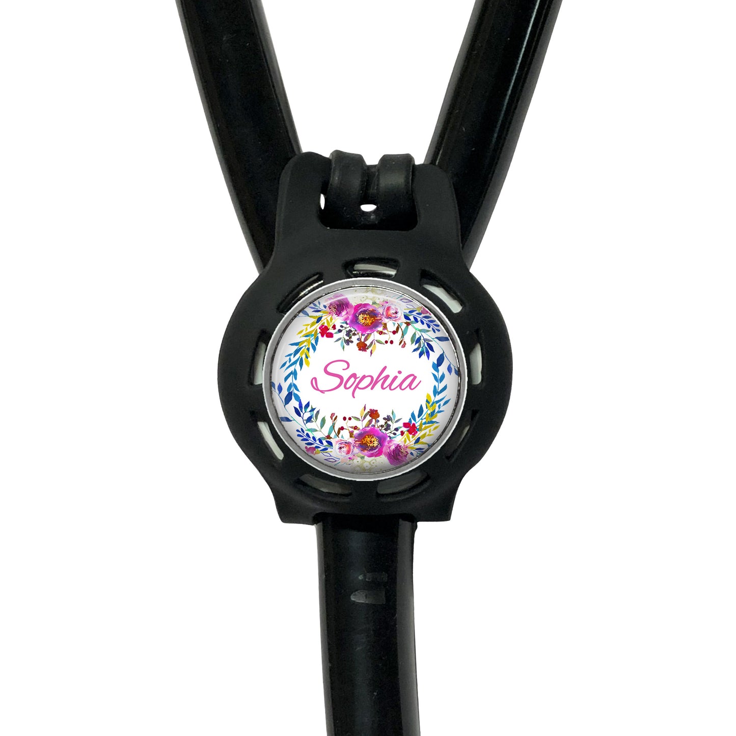 A black stethoscope with a personalized name badge attached to it.