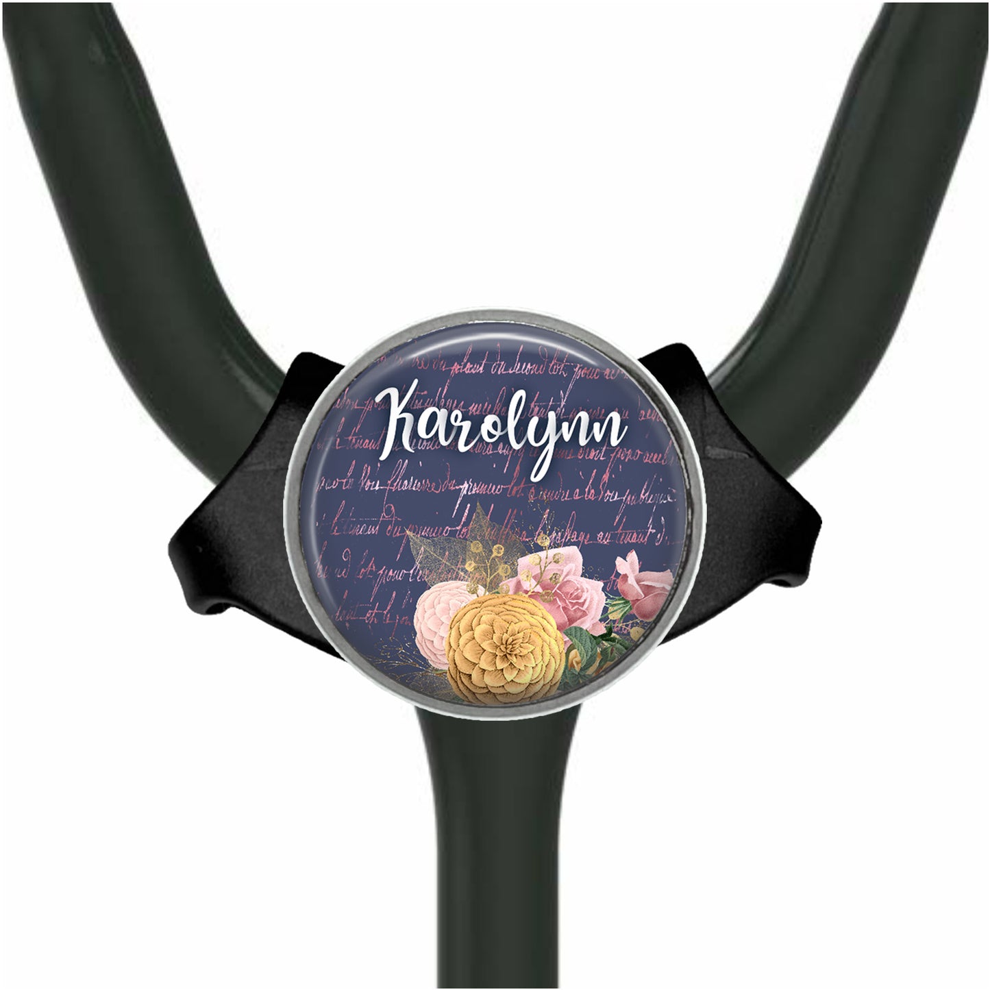 A round, black object with a floral design and the name "Karen" written on it.