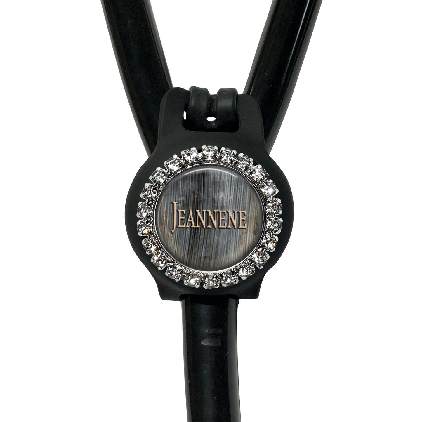 A black stethoscope with a round, embossed logo on the front.