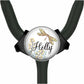 A round, black-and-white medical device with a colorful, floral design and the name "Holly" written on it.