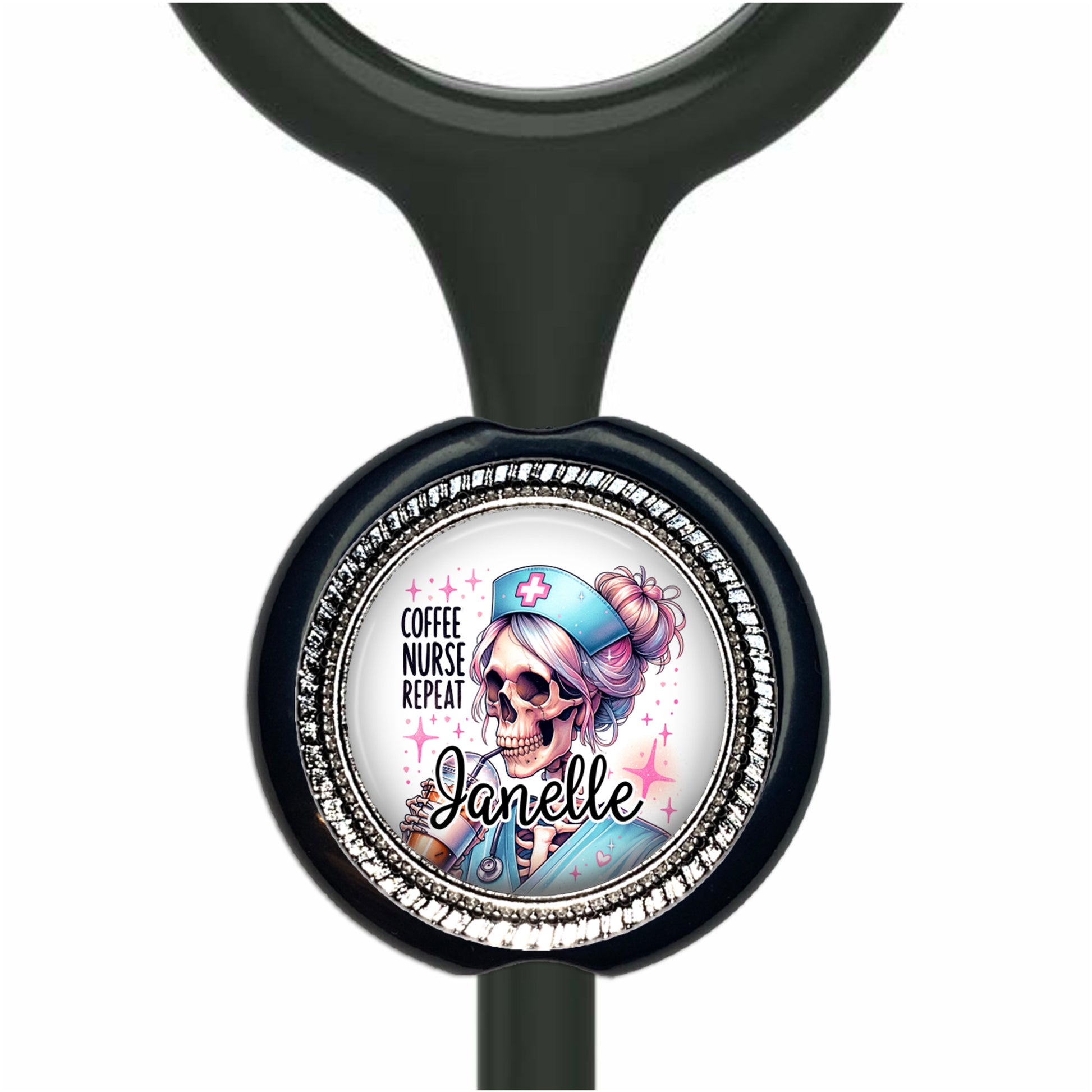 A black stethoscope with a round badge featuring a cartoon image of a skeleton wearing a nurse's hat and the text "Coffee Nurse Repeat Janelle".