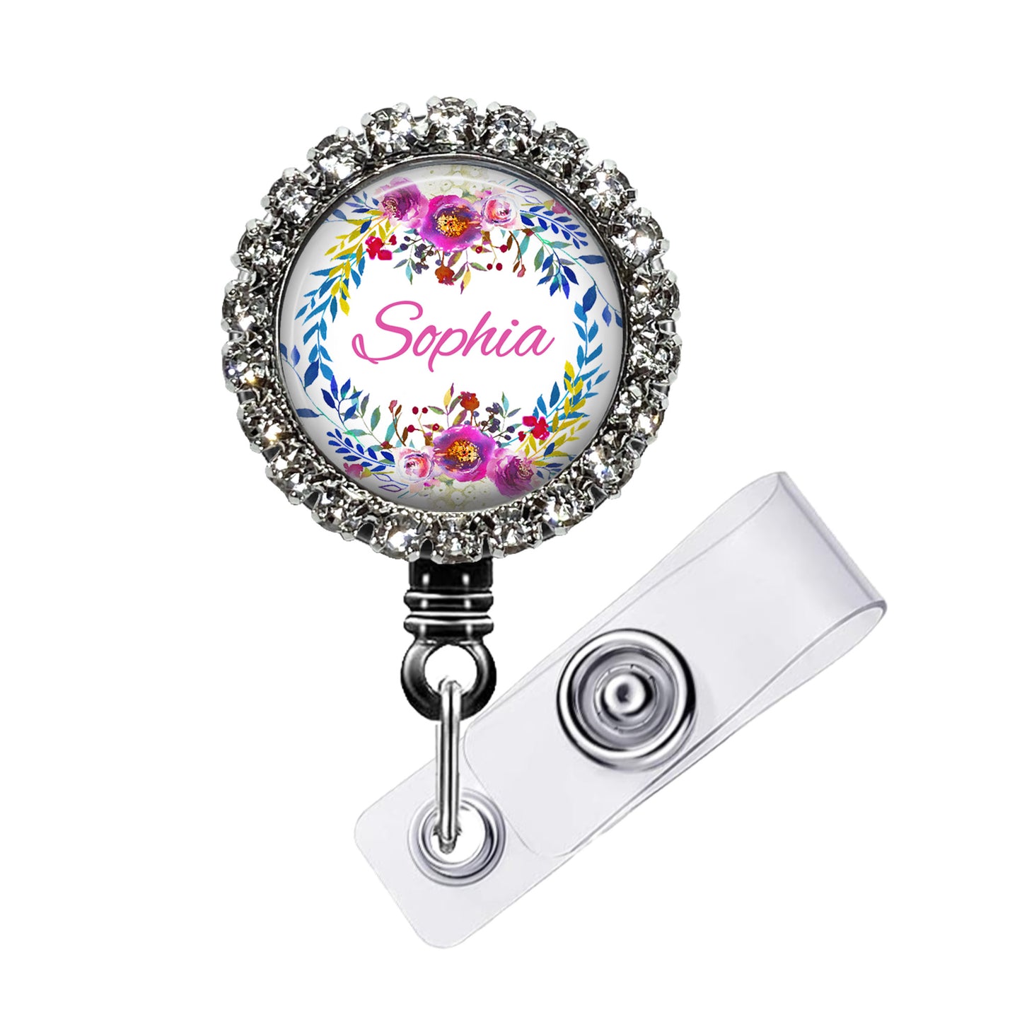 A personalized name badge with a floral design and the name "Sophia" printed on it. The badge is attached to a clear plastic holder with a metal clasp.