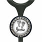 A personalized nameplate with a black background and a silver frame. The nameplate has a white circle with a black outline, and inside the circle, there is a black and white image of a baby's foot. The nameplate is personalized with the name "Jessie".