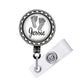 A badge holder with a personalized name tag and a baby footprint design.