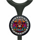 A colorful, circular charm with a skull design and floral patterns.