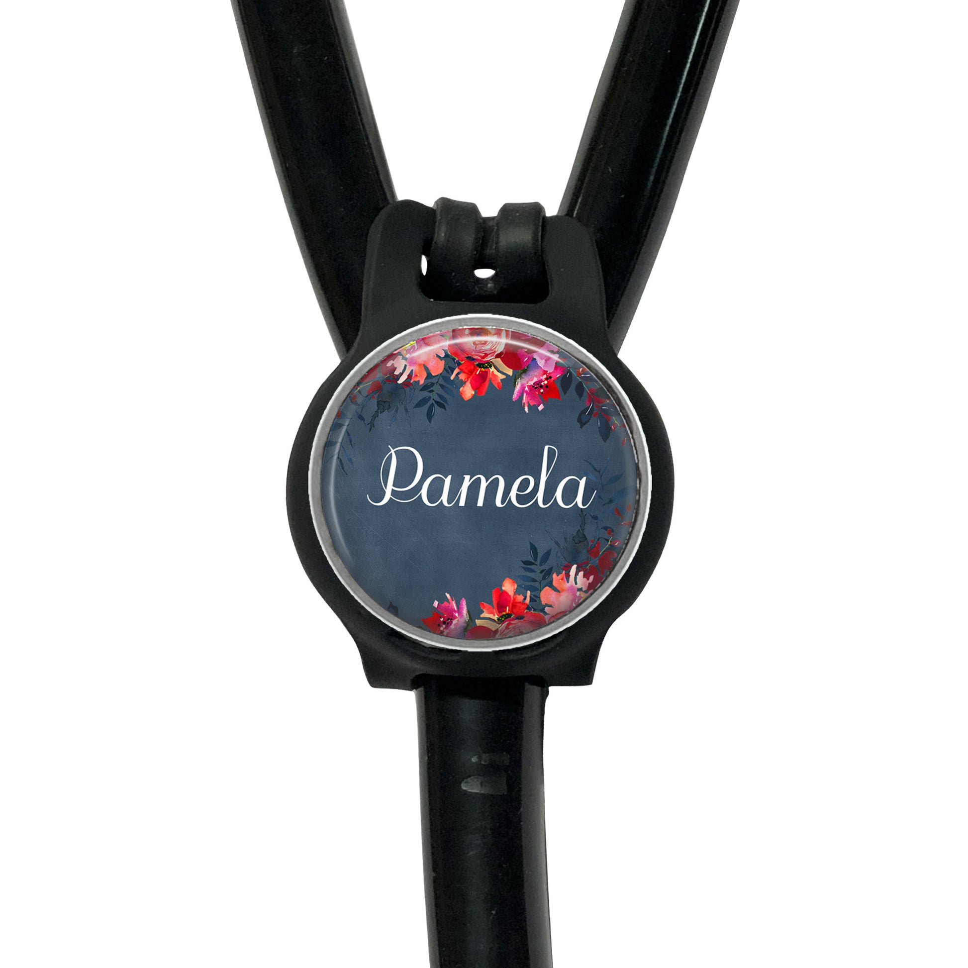A black stethoscope with a round, personalized name tag attached to it.