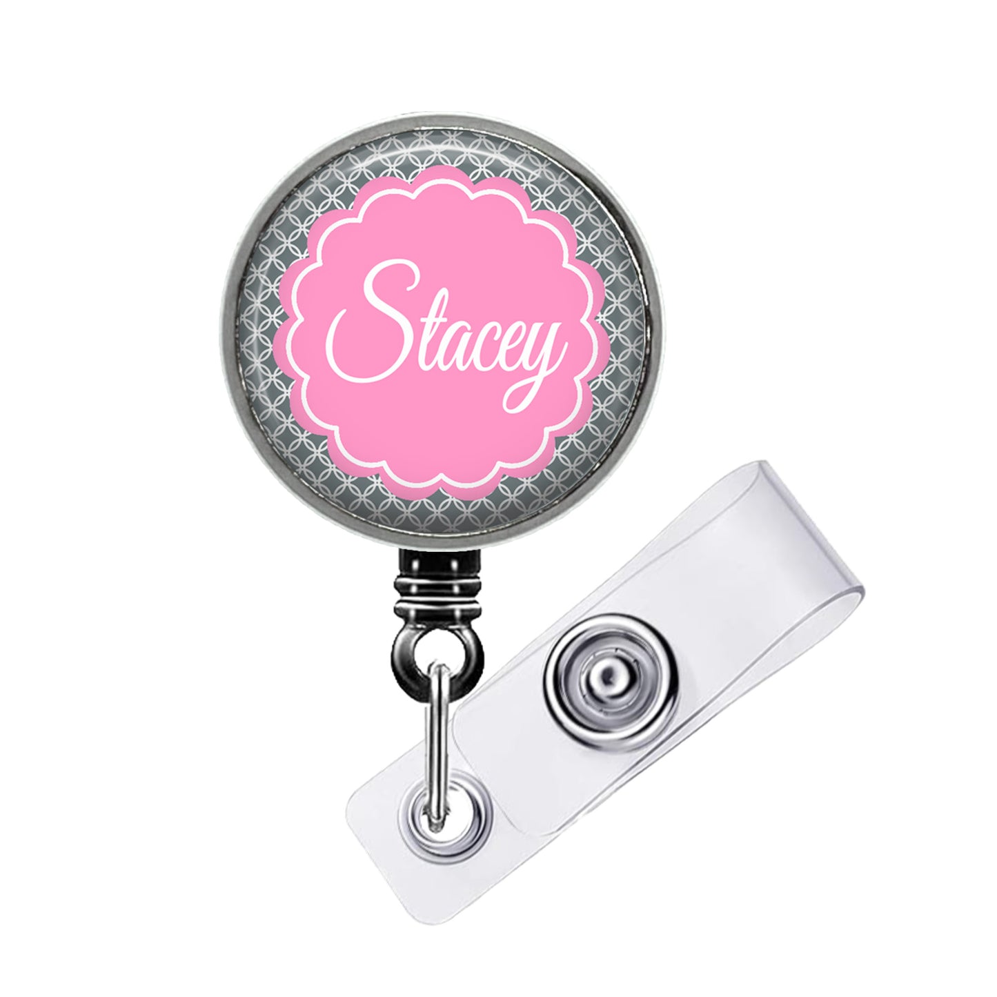 A personalized badge or lanyard with the name "Stacey" printed on it in a pink floral design.