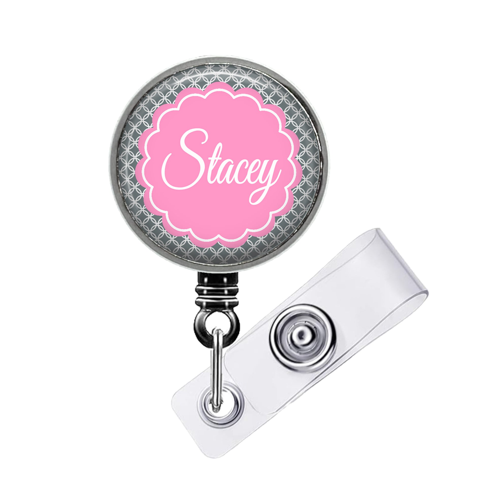 A personalized badge or lanyard with the name "Stacey" printed on it in a pink floral design.