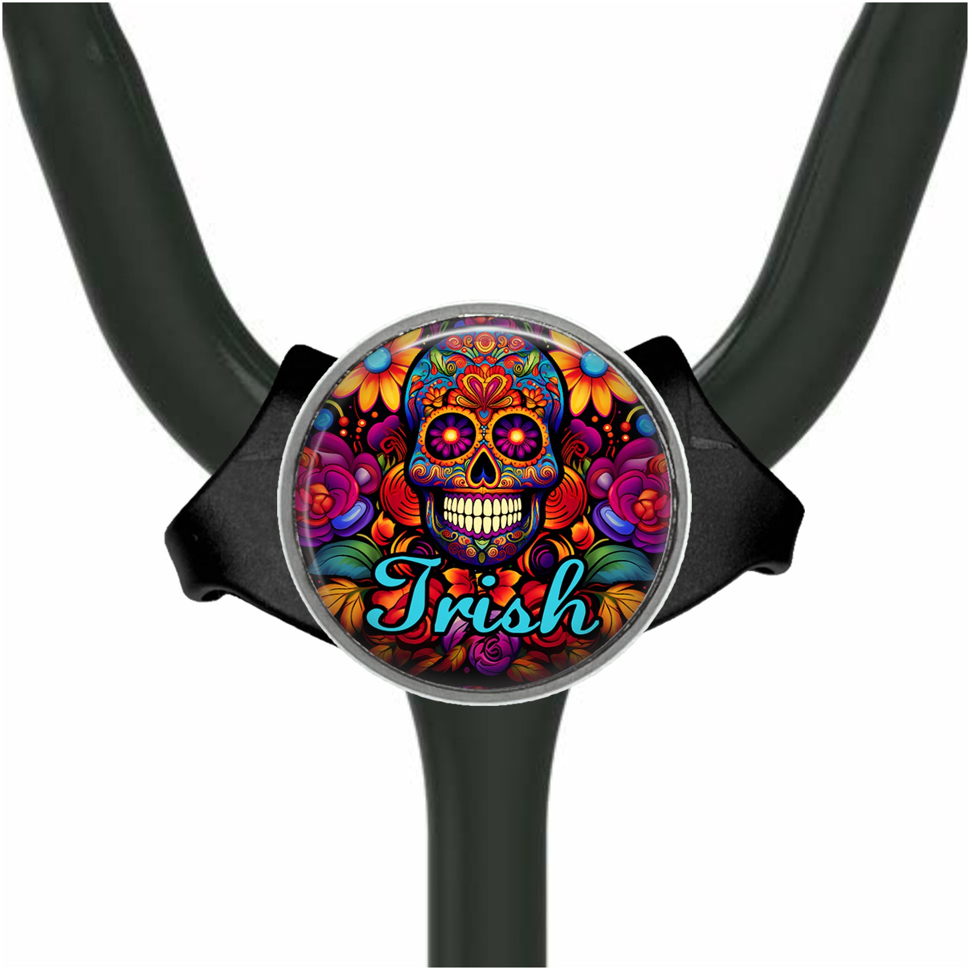A colorful, circular charm with a skull design and floral patterns.