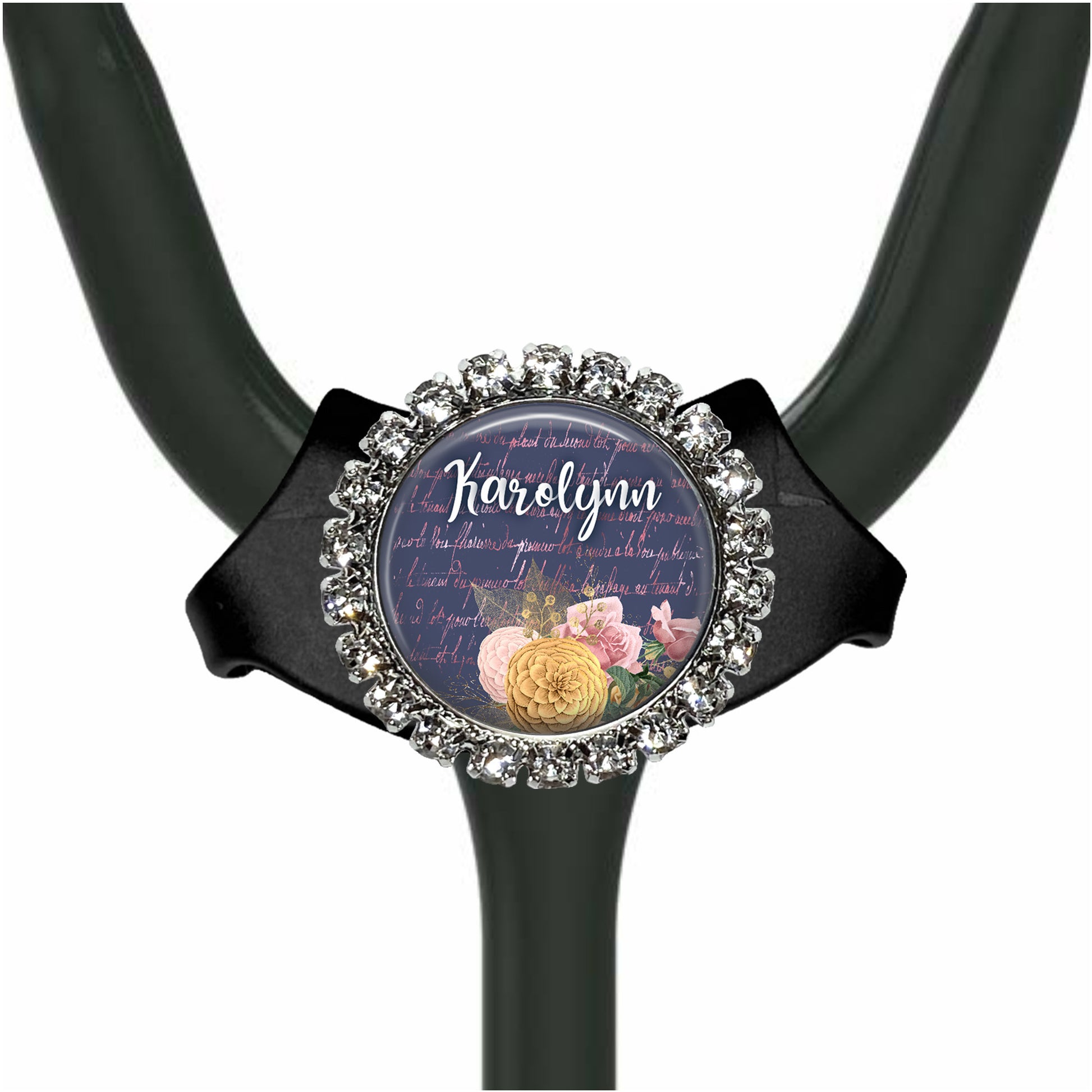 A black stethoscope with a decorative charm featuring a floral design and the name "Harlynn" written on it.
