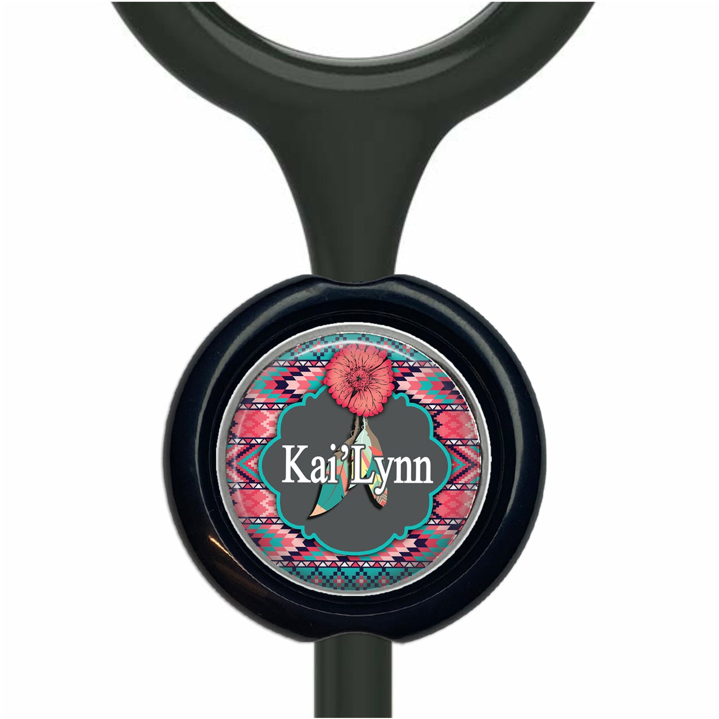 A black stethoscope with a round, personalized nameplate featuring a pink flower and a colorful, patterned border.