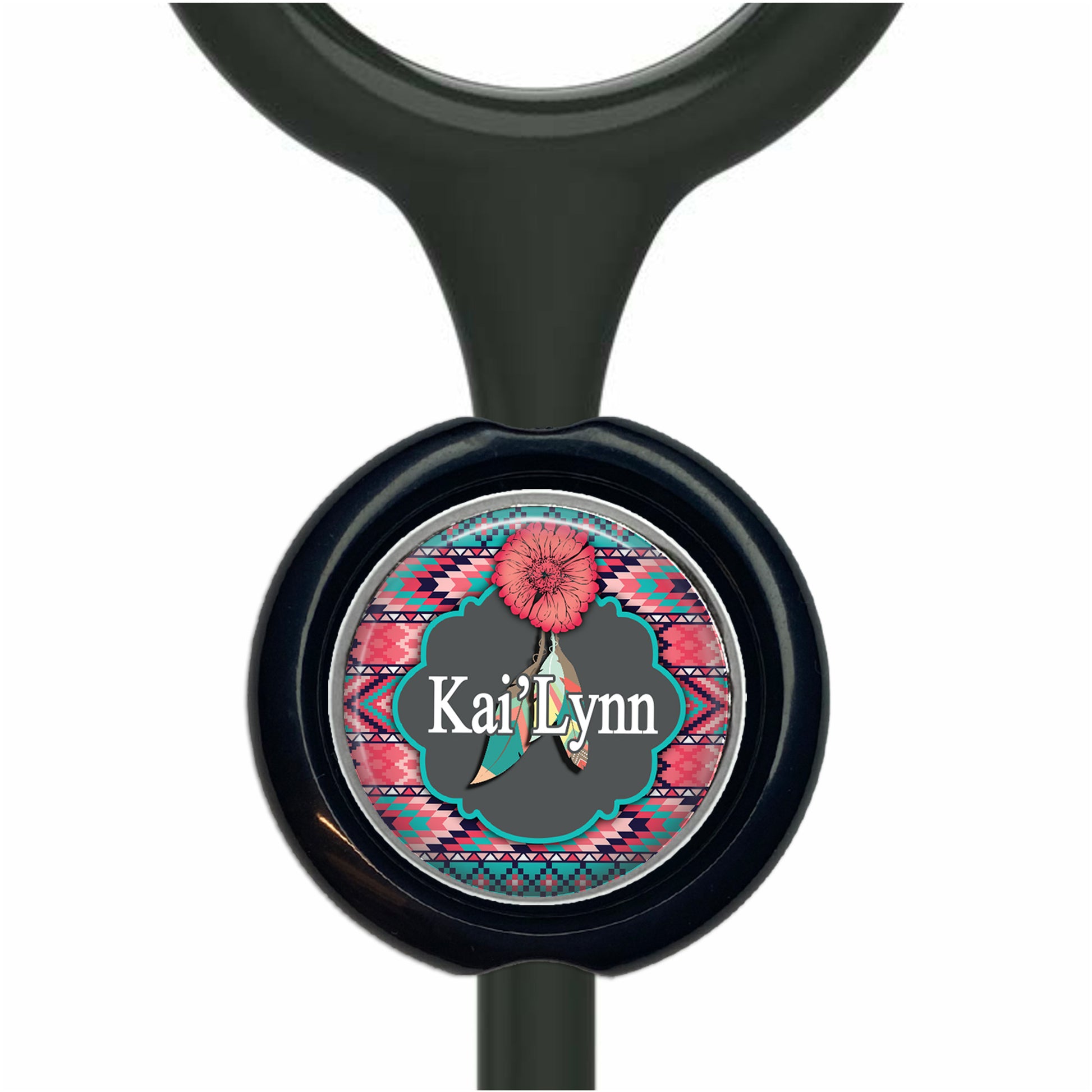 A black stethoscope with a round, personalized nameplate featuring a pink flower and a colorful, patterned border.