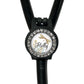 A black stethoscope with a personalized name badge attached to it.