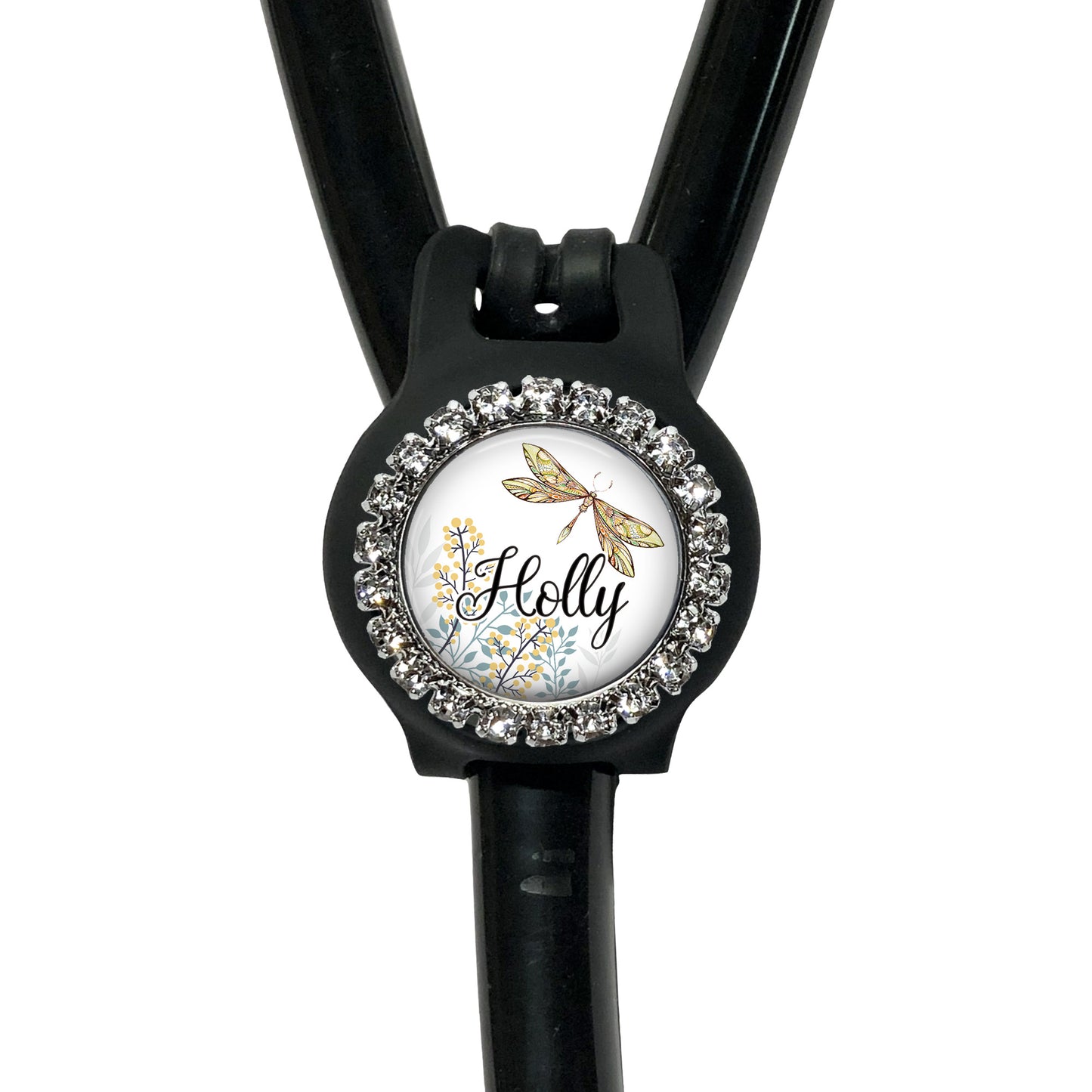 A black stethoscope with a personalized name badge attached to it.